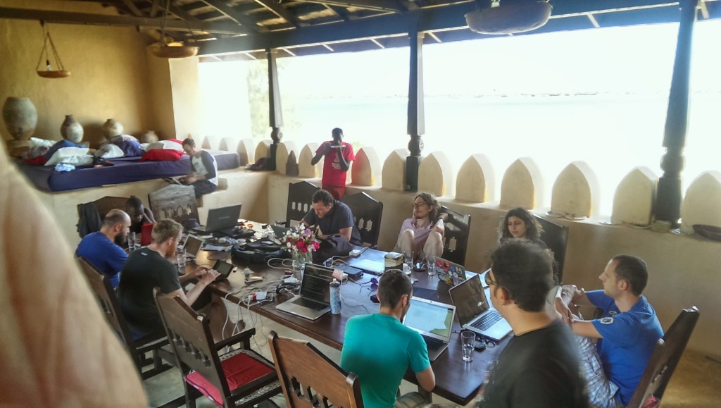 Hackerbeach attendees at the upper dining table